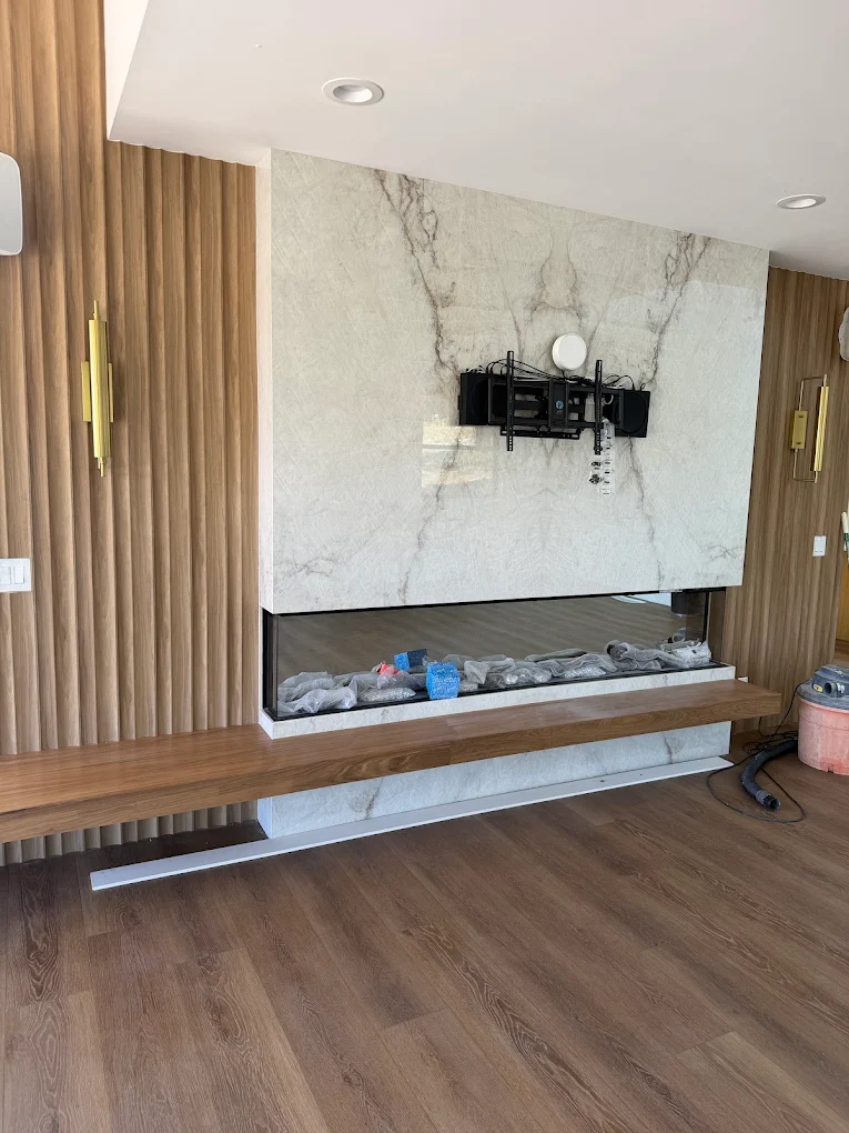 Contractor smiling while holding home renovation plans