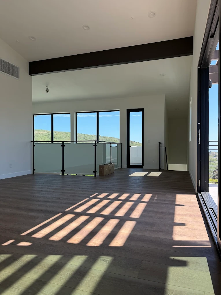 Room addition with open living area by EG Construction